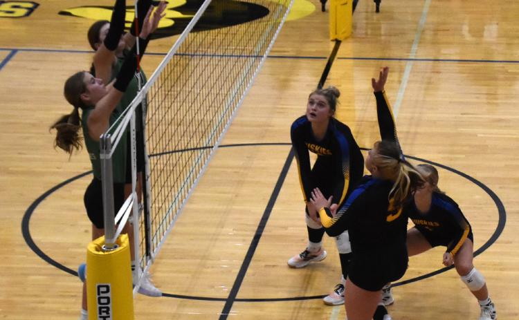 Emma Svoboda gets a kill against the Wilber-Clatonia blockers. PCN photo by Beth Sparrow.
