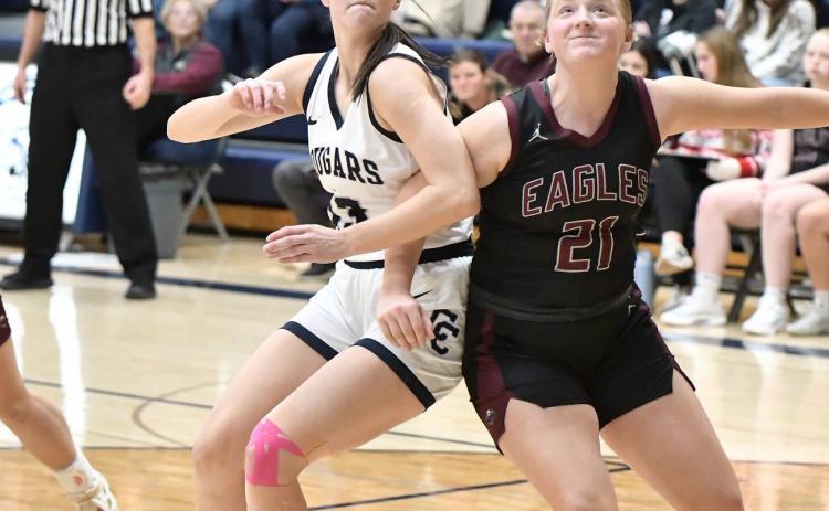 Cross County senior Adrienne Waller (13) tries to get position on the rebound against the BDS defender in Friday night’s game. PCN photo by Rick Holtz