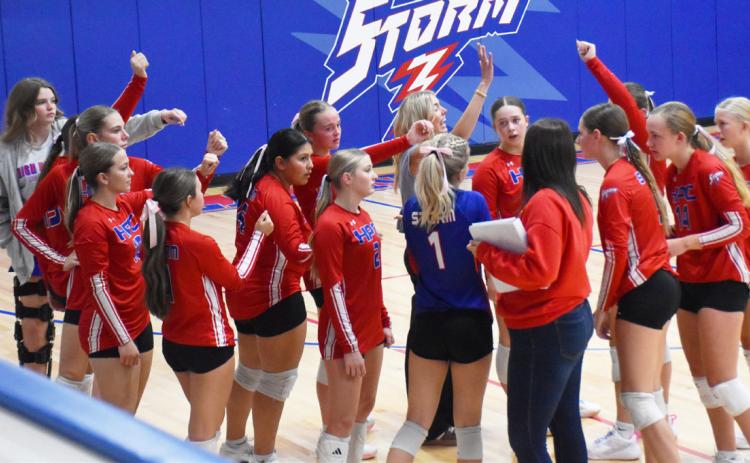 Top- Josie Spurling keeps the ball in play. Top right- The team celebrates their win over H and H. Right below- HallieJo Urkoski tries to work around the CC block. PCN photos by Beth Sparrow.