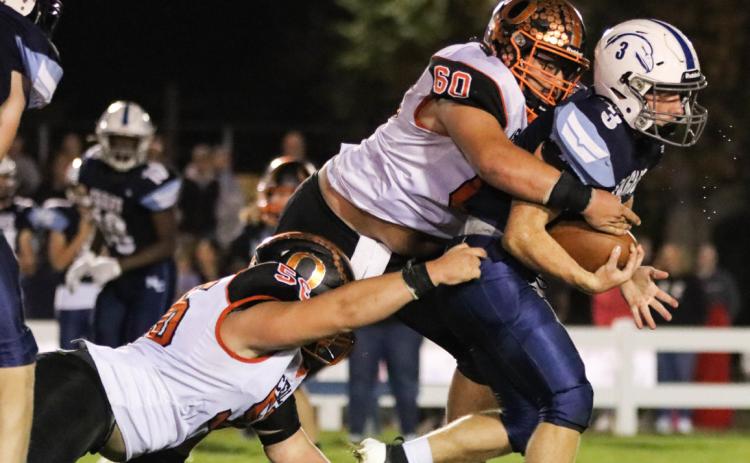 Brenden Gabel makes a tackle for loss of yards with Braylon Peterson’s help. PCN photo by Blaine Winslow.
