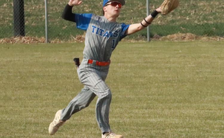 Osceola senior Brayden Santos runs down a fly ball behind the second base bag from his shortstop position for the Twin River Titans. PCN file photo by Ken Kush.