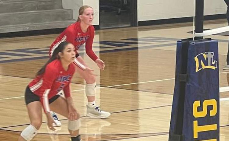 Gahvi Lesiak and Peyton Hofmann are ready for the serve receive. Photo provided by HPC.