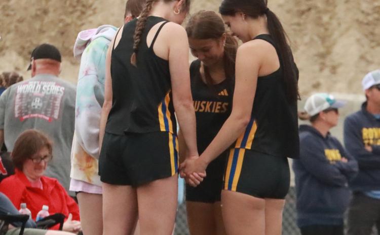 SRC high jumpers, Emma Rabourn, Kynlee Hamling and Alexis Wetjen take some time before start of event at C-2 Districts. PCN photo by Ken Kush