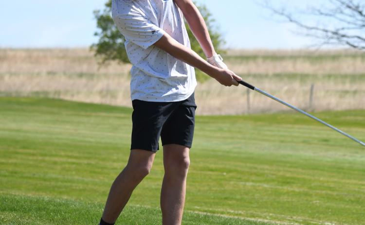Above: Noah Thelen hits his iron from the fairway. SRC Yearbook photo.