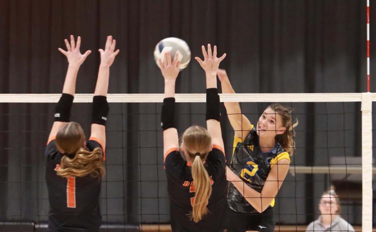 Above: SRC’s Kierslyn Cattau hits the boomer into the Osceola block. Below: Kenzie Bartling (senior, Osceola) hits the kill through the Husky block. Below right: Kaleigh Ruth blocks Alexis Burrit’s kill. PCN photos by Ken Kush.