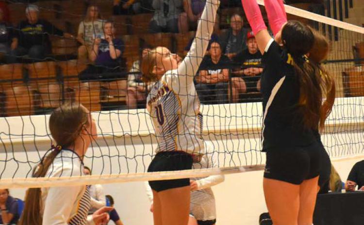 Kayleigh Ruth and Emma Svoboda go up for the block. PCN file photo by Beth Sparrow.