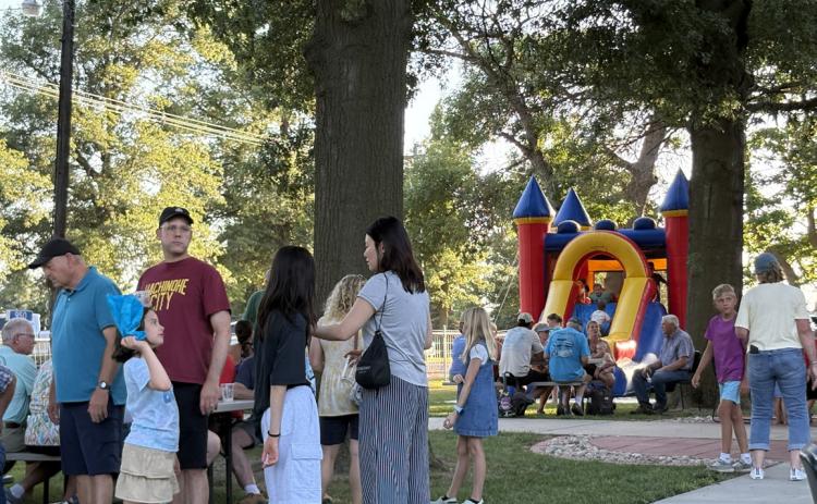 People enjoyed fellowship and ice cream, while kids played on the bouncy house at Calvary Lutheran Church of Swede Home. PCN photo by Beth Sparrow.