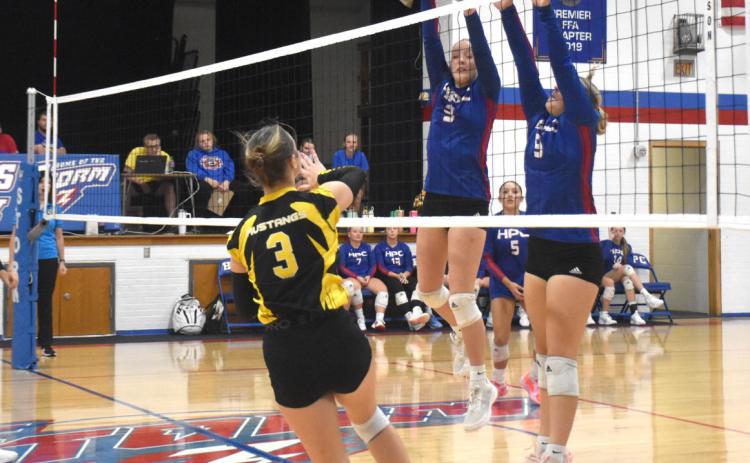 Rylee Hofmann (3) and HallieJo Urkoski (9) deny the attack from the McCool Junction player. PCN photo by Beth Sparrow