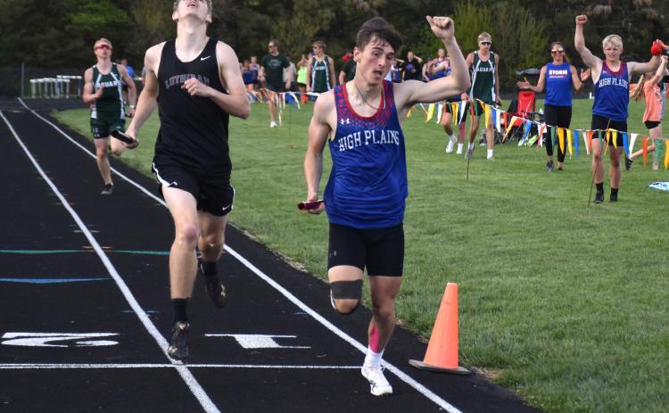 Above: Gavin Morris (HPC) celebrates his fourth gold medal after the 4x400m relay. Teammate Gage Friesen celebrates just behind and to the right. PCN photo by Beth Sparrow.
