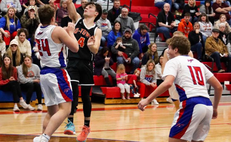 Brayden Santos (Osc) goes for a shot as Ayden Hans (HPC) defends and Chase Owens (HPC) readies for a rebound. PCN file photo by Blaine Winslow.