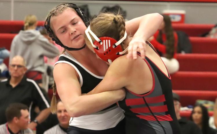 Cross County/Osceola senior Ema Dickey battles Camber Renz of Superior. Dickey placed fourth at 170.