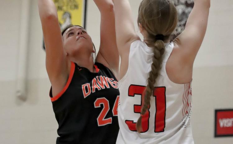 Courtney Sunday grabs a rebound against Meridian. PCN photo by Blaine Winslow.