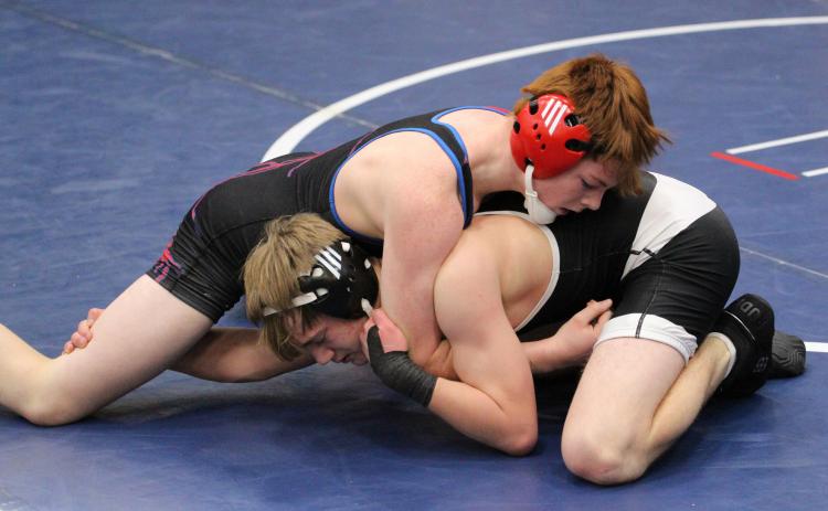 Makayo Confer (HPC, top) wrestles Cooper DeWitt (CCO, bottom). PCN photo by Travis Lane.
