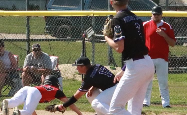 Layne Donner slaps the tag in the Aurora Post 42 base runner as he is called out on the throw from SOS pitcher Tommie Rediger. PCN photo by Ken Kush.