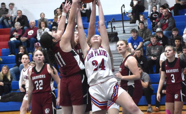 High Plains freshman Taya Hans battles for one of her 13 rebounds and 12 points against Fullerton. PCN photo by Beth Sparrow.
