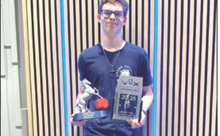Cross County’s 5155E (Cereal Killers), Sam Haug, pictured qualified for state robotics, placing first in skills and bringing home the tournament champion trophy. PCN photo by Beth Sparrow.