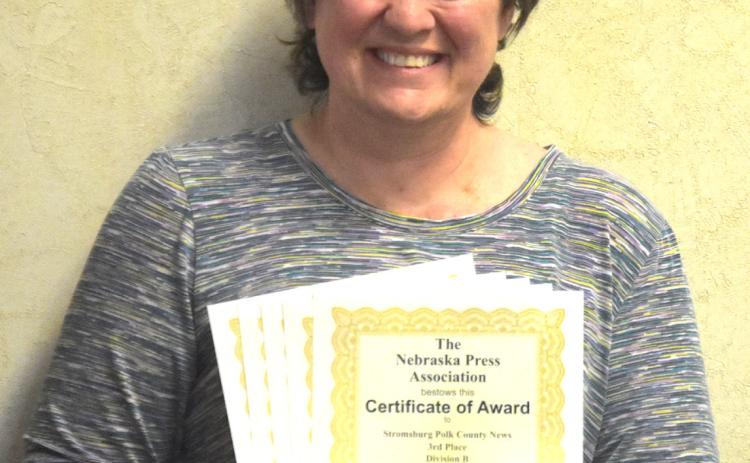 Above: Co-owner Beth Sparrow shows off the awards received at conference this last weekend. PCN photo by Kirk Sparrow.