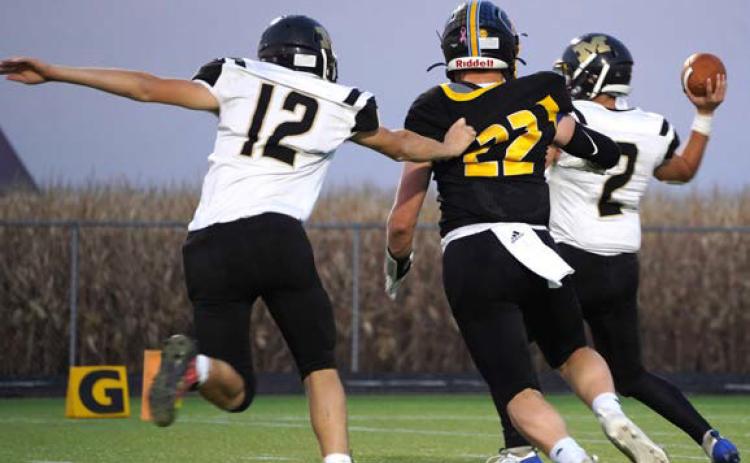 Coy Vrbka pursues the quarterback as another Mustang tries to take him down. PCN photo by Jen Vrbka.