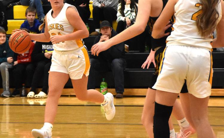 Olivia Adams dribbles the ball and looks for a Husky to pass to. PCN file photo by Beth Sparrow.
