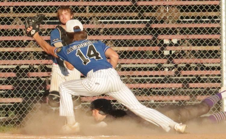In the bottom of the first, SOS’s Kelby Neujahr scores on a wild pitch to tie the score at the time against Ravenna 1-1. The Rebels won the game 9-1. PCN photo by Ken Kush.