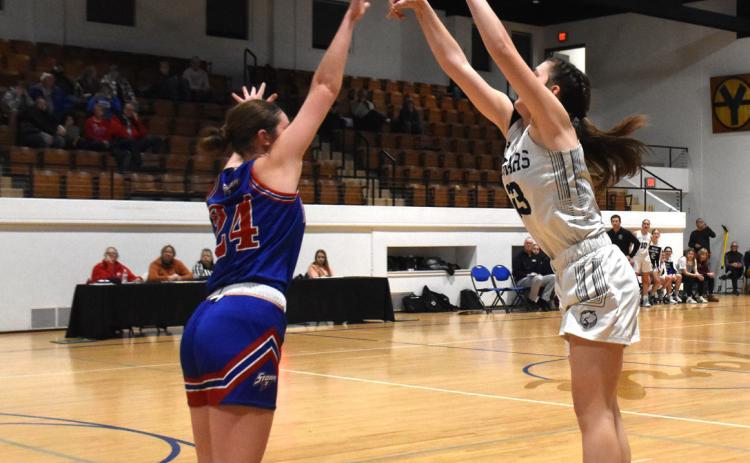 ABOVE: Lindee Kelley (CC) shoots over the hands of Rylee Ackerson (HPC) at the CRC tourney. PCN photo by Beth Sparrow. BELOW: Kayleigh Ruth (SRC) shoots against David City earlier this month. PCN file photo by Beth Sparrow.