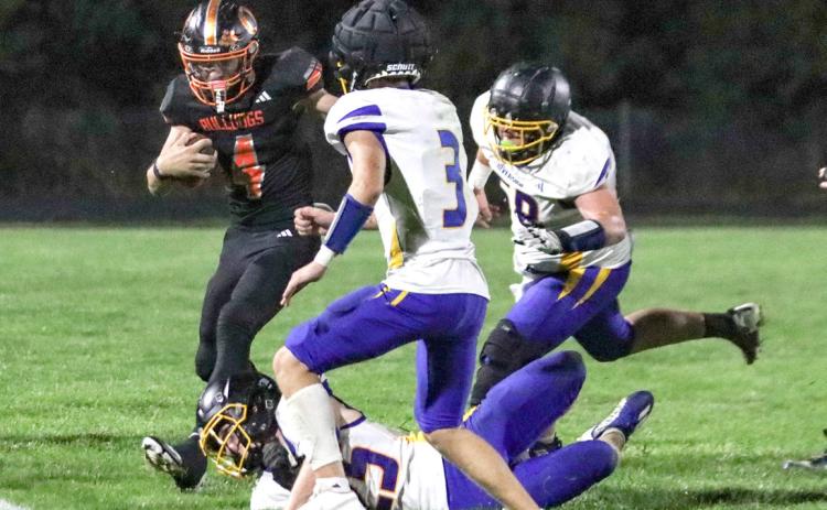 Osceola sophomore Landan Drozd (4) is confronted as he tries to turn the corner against the Riverside Chargers defense in Friday night’s Homecoming win in Osceola. PCN photo by Blaine Winslow.