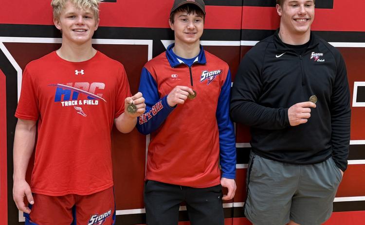 Three HPC senior wrestlers took first place at Pleasanton: Gage Friesen, Hudson Urkoski and Caleb Sharman. Photo provided.