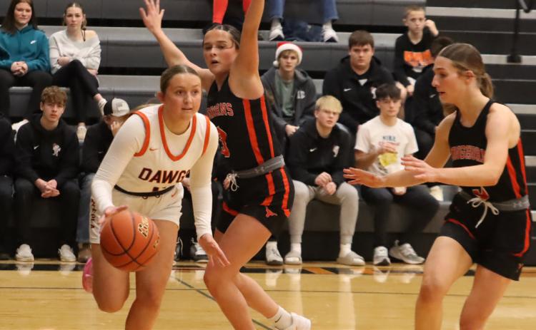Osceola senior Emersyn Prososki drives the baseline. Prososki scored five points in the win over Dorchester and 23 in the loss to Aquinas. PCN photo by Ken Kush.