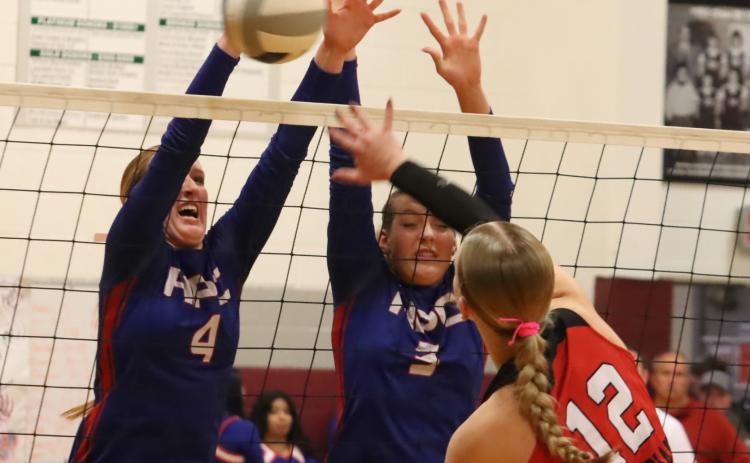 The Hofmanns (Peyton and Rylee) get their hands on this Meridian attack during Monday night’s D2-4 subdistrict game at Shickley. The Storm could not get past the Meridian team for a third time this year and saw their season come to and end with a record of 16-14, saying good-bye top five seniors. PCN photo by Ken Kush.