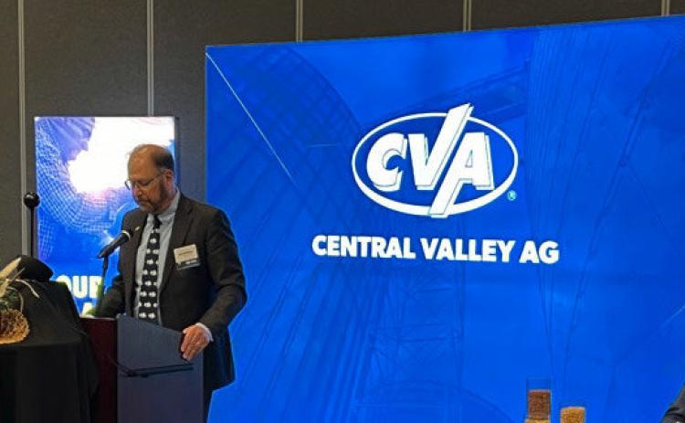 Carl Dickinson, president and CEO of CVA announces payouts at their annual meeting. The cooperative returned over $24.0 million in cash to its members through equity redemptions and patronage dividends. Photo provided.