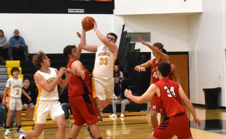 Aiden Zimmerman grabs the rebound Saturday against Meridian. PCN photo by Beth Sparrow.