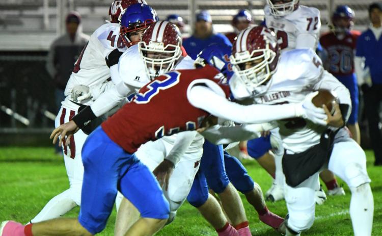 Carter Urkoski goes for the tackle and the football against Fullerton on Friday. PCN photo by Rick Holtz.