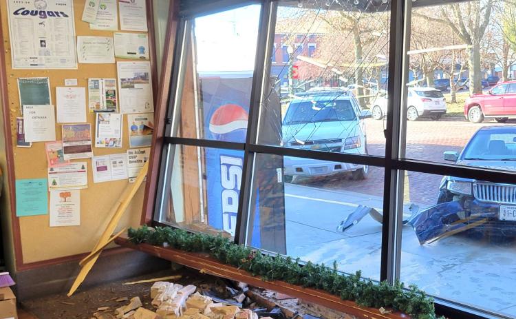 The vehicle sustained damage to the front bumper and the building received significant damage to the windows and bricks. Above photo provided, below PCN photo by Beth Sparrow.
