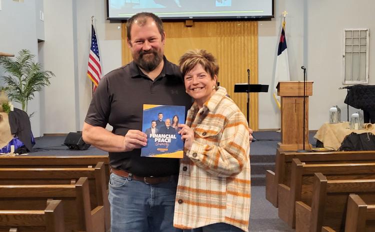 Charles and Neeli Noyd are leading a class in Dave Ramsey’s Financial Peace University. PCN photo by Beth Sparrow