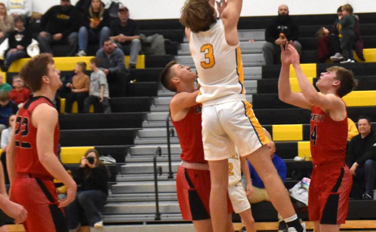Dalton Pokorney takes the ball up for a basket against David City earlier this month. PCN file photo by Beth Sparrow.