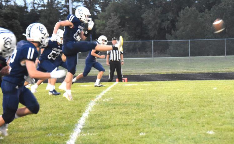 Langdon Arbuck kicks off against Gibbon with the team ready for defense. PCN photo by Kirk Sparrow.