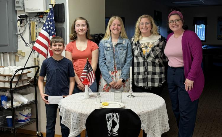Pictured are the winners of the Stromsburg Legion’s essay contest. Left to right: Henry Cramer (1st), Molly Tandy (3rd), Cortlyn Sundberg (2nd), Mrs. Nielsen, and Mrs. Woodruff. Photo provided.