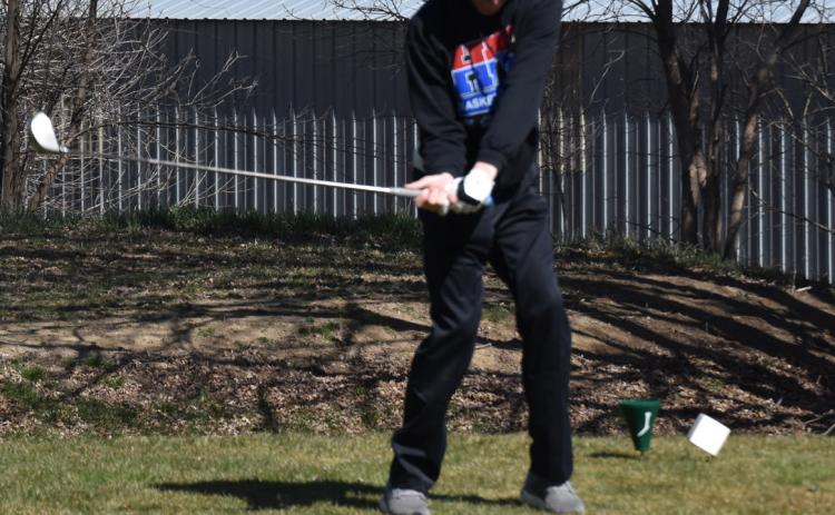 A High Plains golfer tees off earlier in the season in Osceola. PCN file photo by Cienna Friesen.