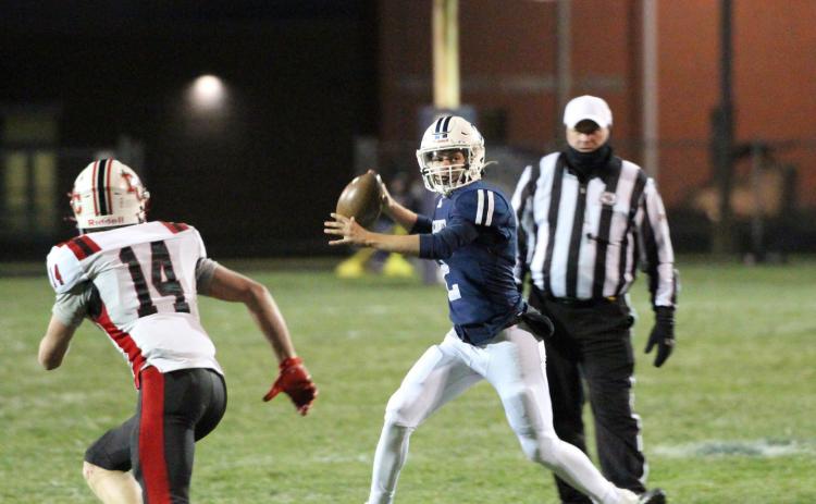 Lucas Jacobsen tries to throw a pass past the Perkins County defender. PCN photo by Travis Lane.