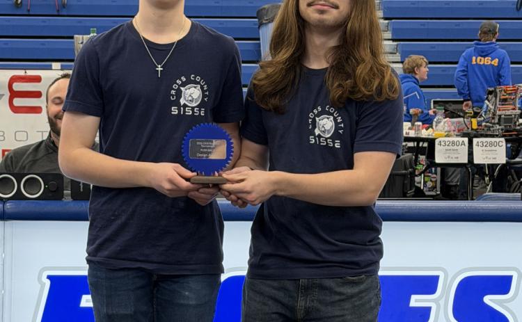 Above: Cross County robotics had a rough day at O’Neill but 5155E “Cereal Killers” (Sam Haug and Brad Lott, pictured) still came home with the design award. Photo provided by Heather Haug. More on robotics on page 4 (Headlight).