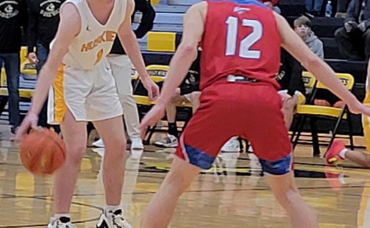 Gabe Dutton-Mofford sets up the offense for the Huskies as Hayden Helgoth plays defense for the Storm. PCN photo by Beth Sparrow