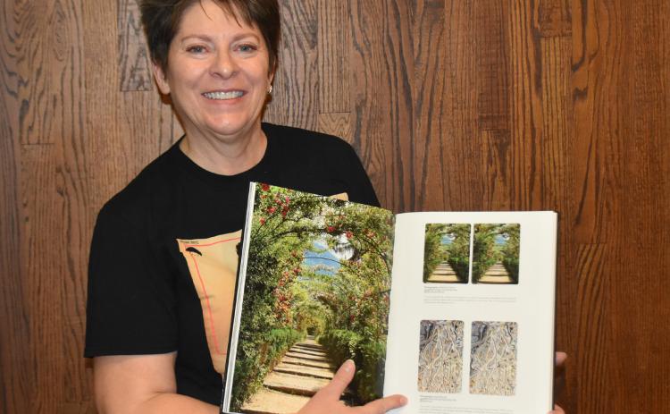 April Stevens gets her 3-D photo published in a book by Queen member Brian May. PCN photo by Beth Sparrow