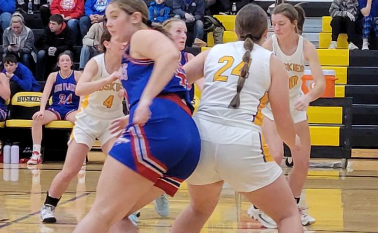 The Huskies and Storm battled for position after a free throw for a rebound. PCN photo by Beth Sparrow