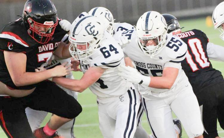 A successful running game starts up front. The Cougars ran for 356 yards on Friday at David City. Here Devin Lonsdale (64) and Gabe Nuttelman (55) clear the path for the backs. PCN photo by Travis Lane.