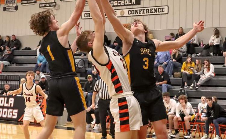 Gabe Dutton-Mofford and Dalton Pokorney (SRC) fight for the rebound against Braxton Mestl (OSC). PCN photo by Blaine Winslow.