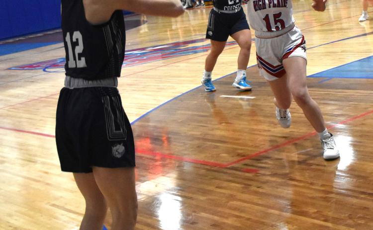 Addie Linn (CC) shoots a three as Rylee Hofmann (HPC) comes to block. PCN photo by Beth Sparrow.