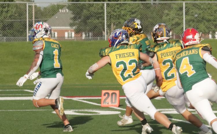 Above-High Plains Storm Gage Friesen (22) is in pursuit of the West kick returner in Saturday night’s Eight Man All-Star Game in Hastings. PCN photo by Ken Kush.