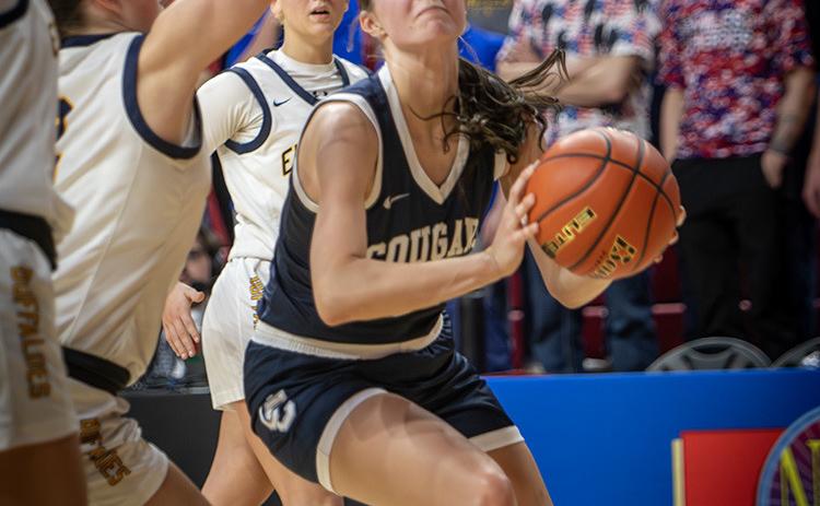 Cross County senior Adrienne Waller (13) has her eyes glued on the basket during Thursday’s opening game of the Class D-1 State Tournament in Lincoln. Waller led the Cougar’s with eight points, all from the free throw line. Cross County suffered their worst shooting night of the season in a 47-21 loss to Elm Creek. PCN photo by Rick Holtz.