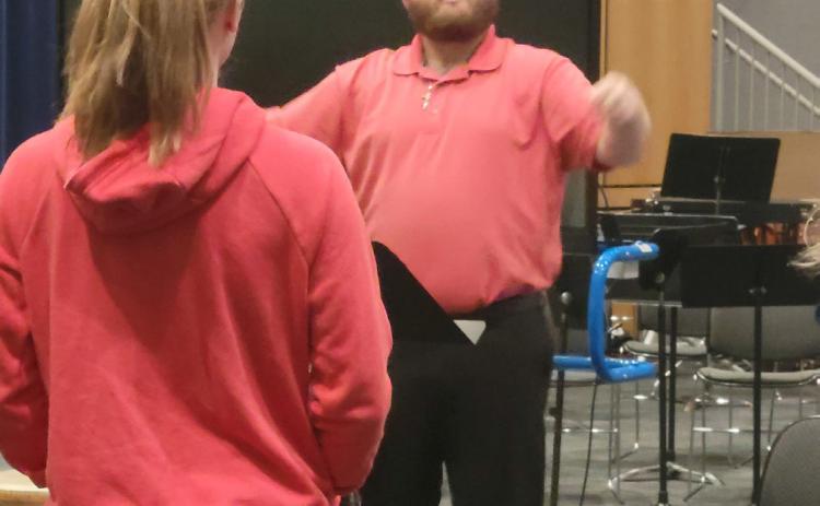 Dalton Rath, Cross County's new music teacher, directs the high school choir on Tuesday. PCN photo by Beth Sparrow