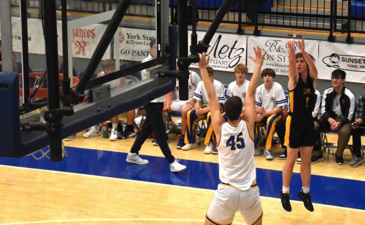 ABOVE: Gabe Dutton-Mofford shoots a three against Nebraska Lutheran. PCN photo by Beth Sparrow.